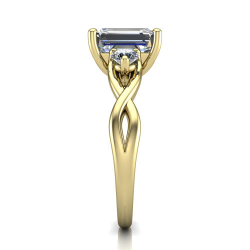 Lydia emerald three stone engagement ring in 14K Yellow Gold, side profile showing the round side diamonds, floral gallery, and woven infinity shank
