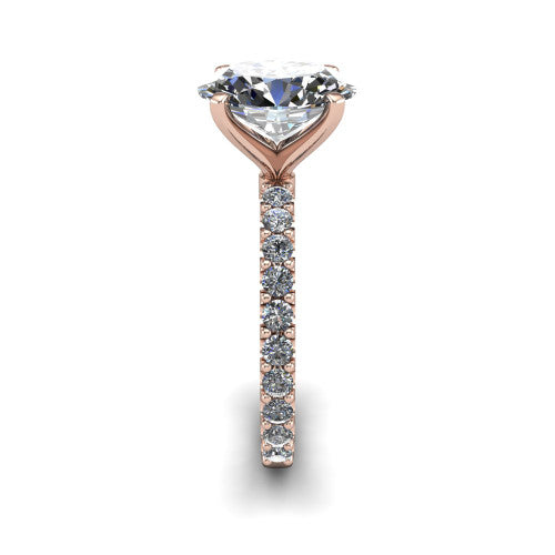 Elizabeth oval solitaire engagement ring in 14K Rose Gold, side profile showing the pave diamonds running continuously around the shank
