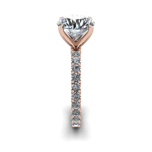 Elizabeth round solitaire engagement ring in 14K Rose Gold, side profile showing the pave diamonds running continuously around the shank