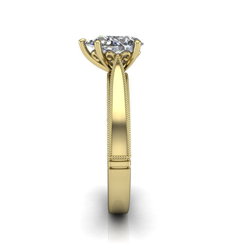 Adeline pear solitaire engagement ring in 14K Yellow Gold, side profile showing the wide flat-top band with milgrain bead borders along top and bottom