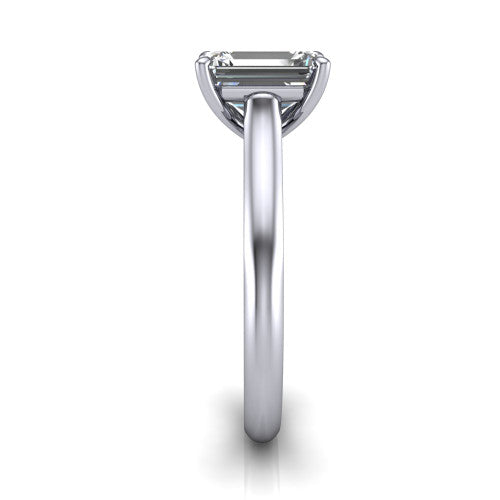 Saylor emerald solitaire engagement ring in Platinum, side profile showing the cathedral head, filigree gallery scrolls, and tapered polished shank
