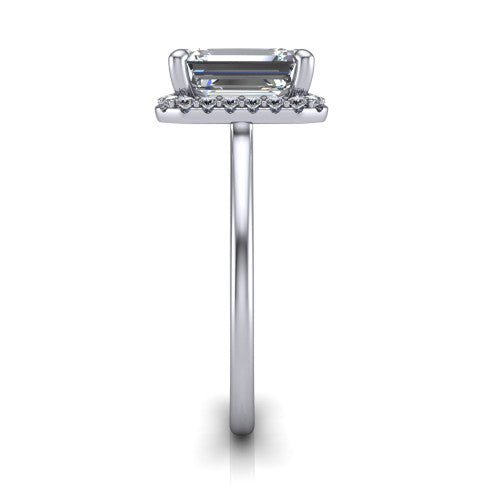 Florence emerald halo engagement ring in Platinum, side profile showing the infinity gallery, slim halo, and thin knife-edge band