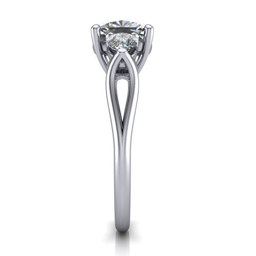 Journee cushion three stone engagement ring in Platinum, side profile showing the split-V gallery, tapered cathedral shoulders, and polished band