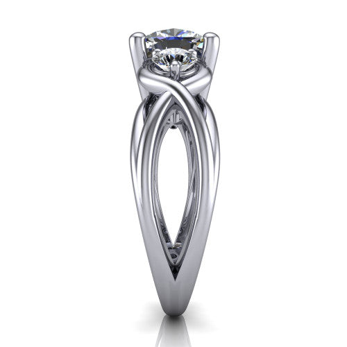 Ottilie cushion three stone engagement ring in Platinum, side profile showing the braided ribbon shank with multiple bands twisting beneath the head