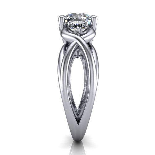 Ottilie round three stone engagement ring in Platinum, side profile showing the braided ribbon shank with multiple bands twisting beneath the head