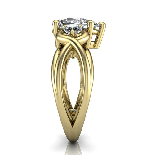 Ottilie pear three stone engagement ring in 14K Yellow Gold, side profile showing the braided ribbon shank with multiple bands twisting beneath the head