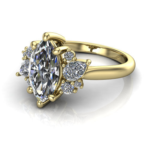 Evie marquise three stone engagement ring in 18K Yellow Gold, three-quarter perspective showing the cathedral rise and accent clusters fanning out on both sides of the center