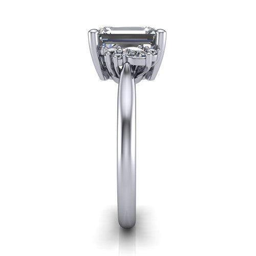 Evie Emerald Shape Three Stone Engagement Ring in Platinum