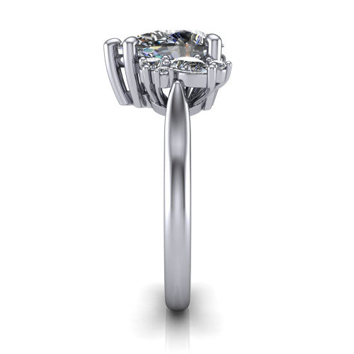 Genevieve pear three stone engagement ring in Platinum, side profile showing the cluster head, tapered cathedral shoulders, and polished band