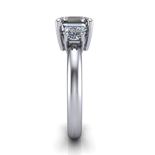 Penelope square emerald three stone engagement ring in Platinum, side profile showing the tall straight-sided basket and slim polished band