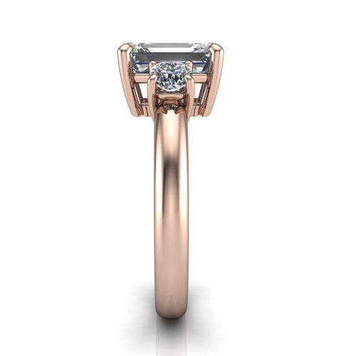 Penelope emerald three stone engagement ring in 14K Rose Gold, side profile showing the tall straight-sided basket and slim polished band