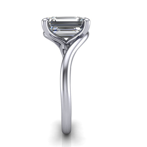 Awren emerald solitaire engagement ring in 18K White Gold, side profile showing the bypass crossover shank and slim polished band