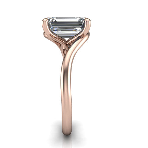 Awren emerald solitaire engagement ring in 18K Rose Gold, side profile showing the bypass crossover shank and slim polished band