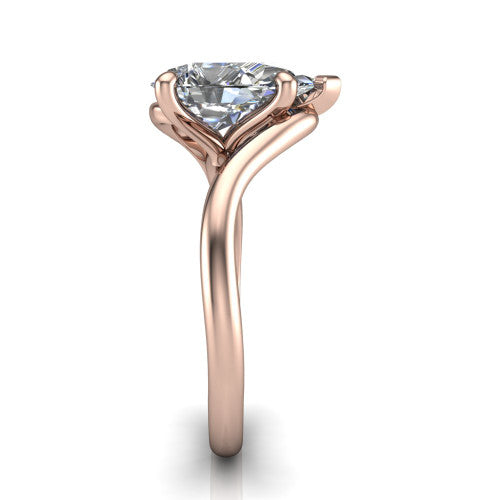 Awren pear solitaire engagement ring in 14K Rose Gold, side profile showing the bypass crossover shank and slim polished band