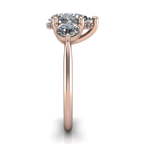 Edith pear hidden halo engagement ring in 18K Rose Gold, side profile showing the tall basket, hidden pave halo beneath the center stone, and slim polished band