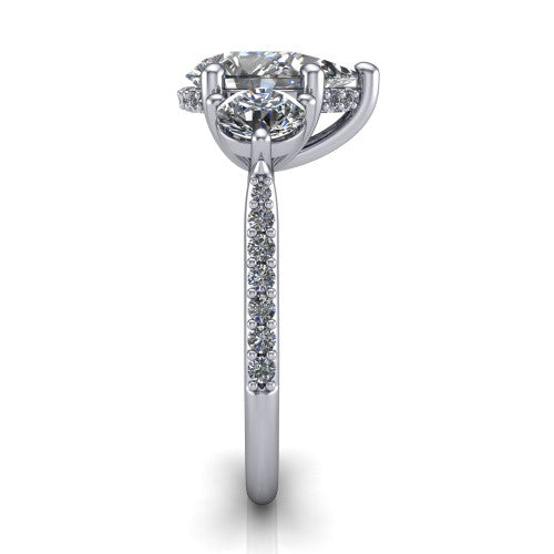 Phoebe pear hidden halo engagement ring in Platinum, side profile showing the hidden halo beneath the center and the pavé diamonds down the shank