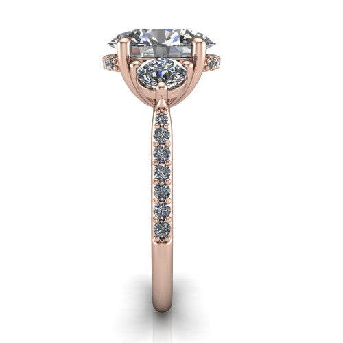 Phoebe oval hidden halo engagement ring in 14K Rose Gold, side profile showing the hidden halo beneath the center and the pavé diamonds down the shank