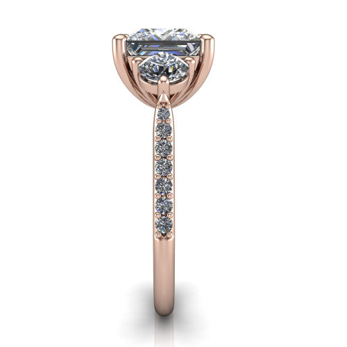 Phoebe princess hidden halo engagement ring in 14K Rose Gold, side profile showing the hidden halo beneath the center and the pavé diamonds down the shank