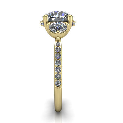 Phoebe round hidden halo engagement ring in 14K Yellow Gold, side profile showing the hidden halo beneath the center and the pavé diamonds down the shank