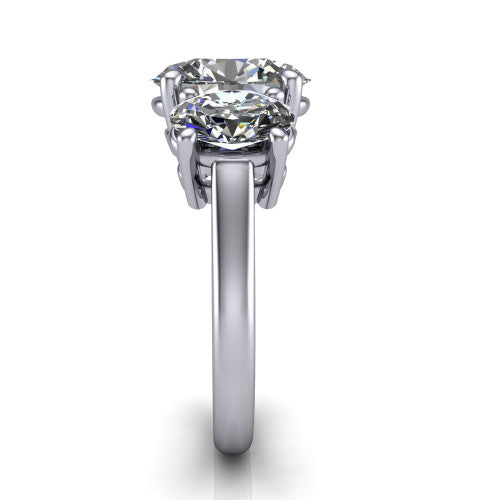 Imogen oval three stone engagement ring in 14K White Gold, side profile showing the round side stone and the smooth tapered polished band