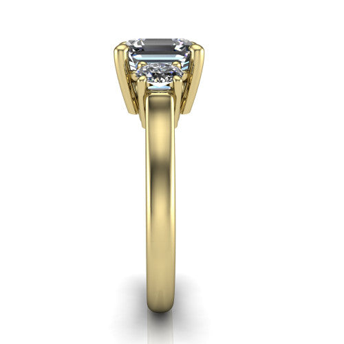 Imogen asscher three stone engagement ring in 14K Yellow Gold, side profile showing the round side stone and the smooth tapered polished band