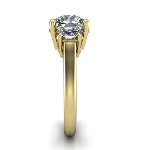 Imogen round three stone engagement ring in 14K Yellow Gold, side profile showing the round side stone and the smooth tapered polished band