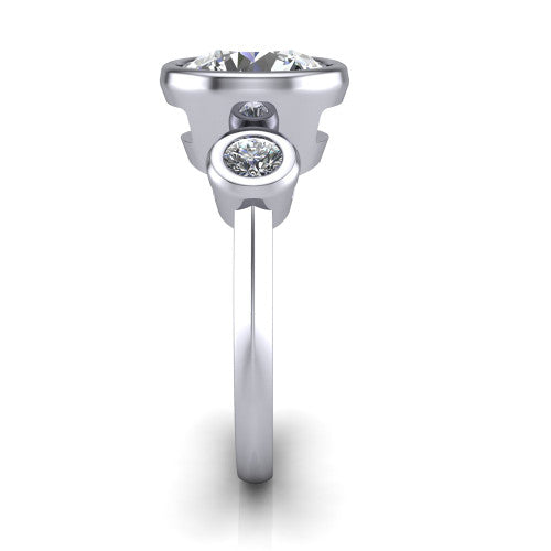 Daisy round three stone engagement ring in Platinum, side profile showing the bezel-set round side stone and the smooth polished band