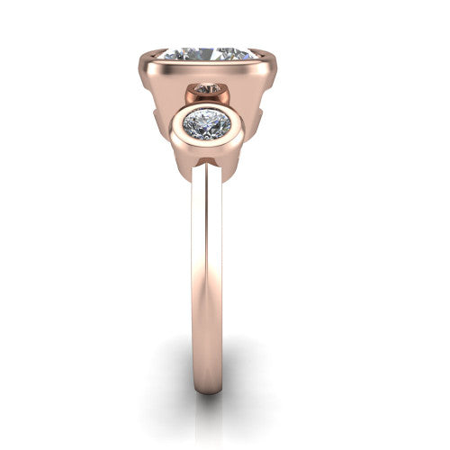 Daisy cushion three stone engagement ring in 18K Rose Gold, side profile showing the bezel-set round side stone and the smooth polished band