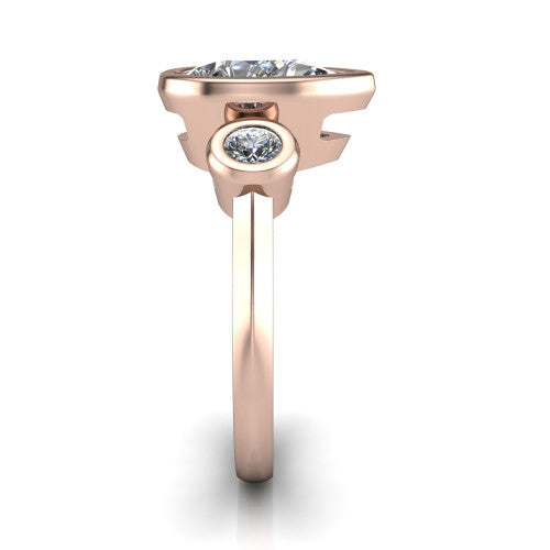Daisy pear three stone engagement ring in 18K Rose Gold, side profile showing the bezel-set round side stone and the smooth polished band
