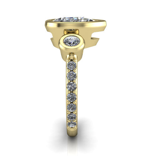Chloe pear three stone engagement ring in 18K Yellow Gold, side profile showing the round bezel side stone and the pavé diamonds running down the shank