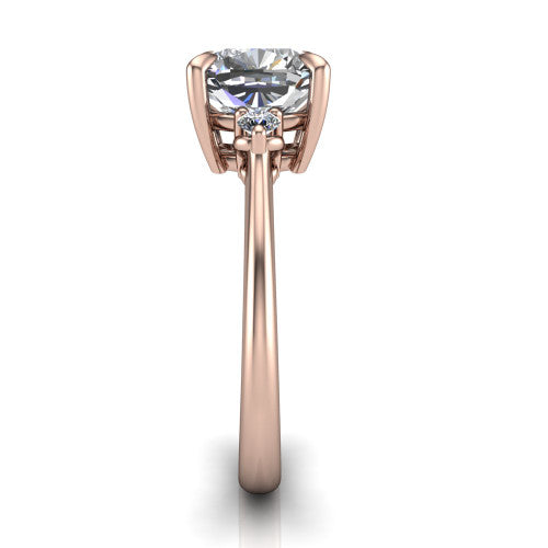 Olive cushion three stone engagement ring in 18K Rose Gold, side profile showing the round side stone and the smooth tapered polished band
