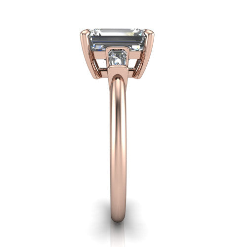 Jade emerald three stone engagement ring in 18K Rose Gold with tapered baguette side stones, side profile showing the plain band and bar-set baguette