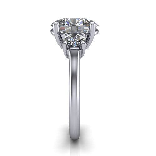 Emma oval three stone engagement ring in 14K White Gold, side profile showing the round side stone and the smooth tapered polished band