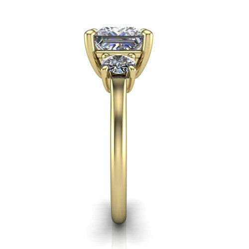 Emma princess three stone engagement ring in 14K Yellow Gold, side profile showing the round side stone and the smooth tapered polished band