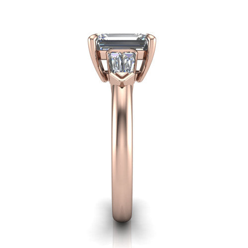 Gracie emerald three stone engagement ring in 18K Rose Gold, side profile showing the baguette side stones and polished band