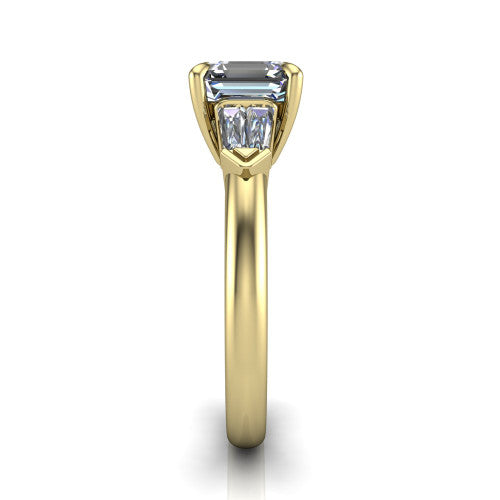 Gracie square emerald three stone engagement ring in 18K Yellow Gold, side profile showing the baguette side stones and polished band