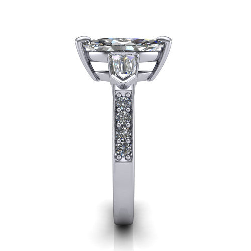 Audrey marquise three stone engagement ring in Platinum, side profile showing the tapered baguette side stone and the round diamonds running down the shank