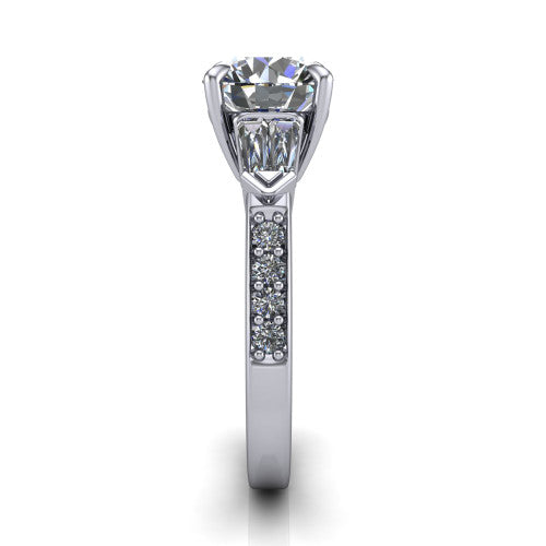 Audrey round three stone engagement ring in 14K White Gold, side profile showing the tapered baguette side stone and the round diamonds running down the shank