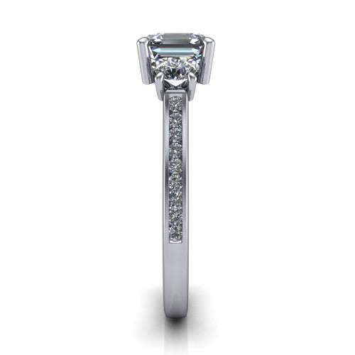 Saoirse asscher three stone engagement ring in 14K White Gold, side profile showing the round side stone and the pavé diamonds running down the shank