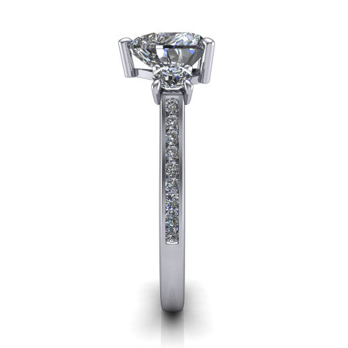 Saoirse heart three stone engagement ring in 14K White Gold, side profile showing the round side stone and the pavé diamonds running down the shank