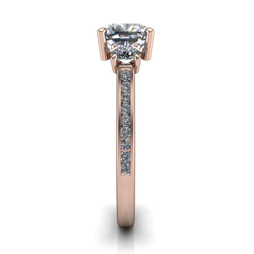 Saoirse cushion three stone engagement ring in 14K Rose Gold, side profile showing the round side stone and the pavé diamonds running down the shank