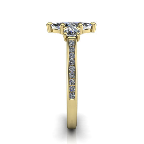 Saoirse marquise three stone engagement ring in 14K Yellow Gold, side profile showing the round side stone and the pavé diamonds running down the shank
