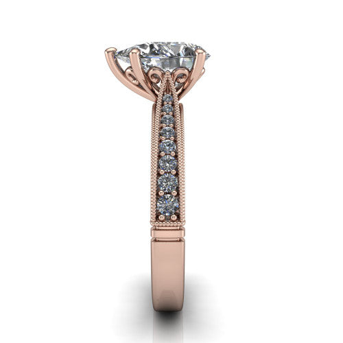 Maeve pear classic engagement ring in 14K Rose Gold, side profile showing the milgrain edges and the round diamonds running down the shank