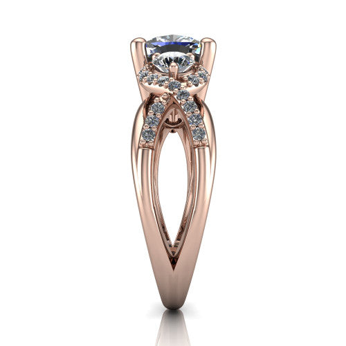 Amara cushion three stone engagement ring in 14K Rose Gold, side profile showing the pavé rails crossing in an infinity twist beneath the head