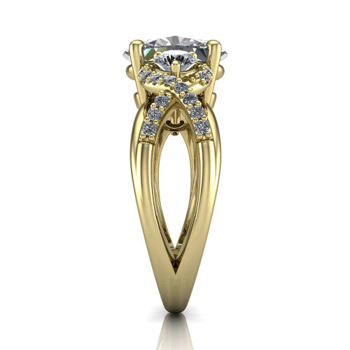 Amara oval three stone engagement ring in 18K Yellow Gold, side profile showing the pavé rails crossing in an infinity twist beneath the head