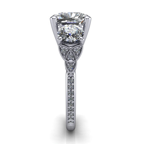 Zion cushion three stone engagement ring in 14K White Gold, side profile showing the trinity-knot shoulder and the pavé diamonds running down the shank