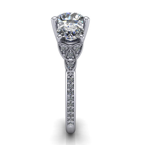 Zion round three stone engagement ring in 18K White Gold, side profile showing the trinity-knot shoulder and the pavé diamonds running down the shank
