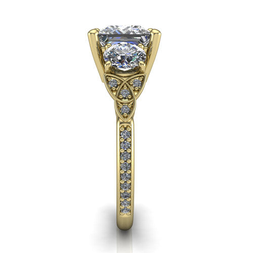 Zion princess three stone engagement ring in 18K Yellow Gold, side profile showing the trinity-knot shoulder and the pavé diamonds running down the shank
