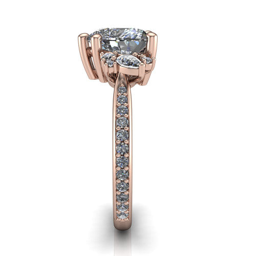 Mila heart three stone engagement ring in 14K Rose Gold, side profile showing the round accent cluster and the pavé diamonds running down the shank