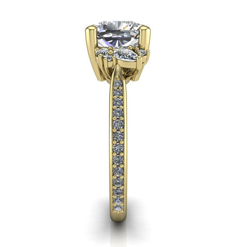 Mila cushion three stone engagement ring in 14K Yellow Gold, side profile showing the round accent cluster and the pavé diamonds running down the shank